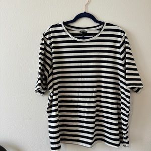 Black and white striped top with longer sleeves.
